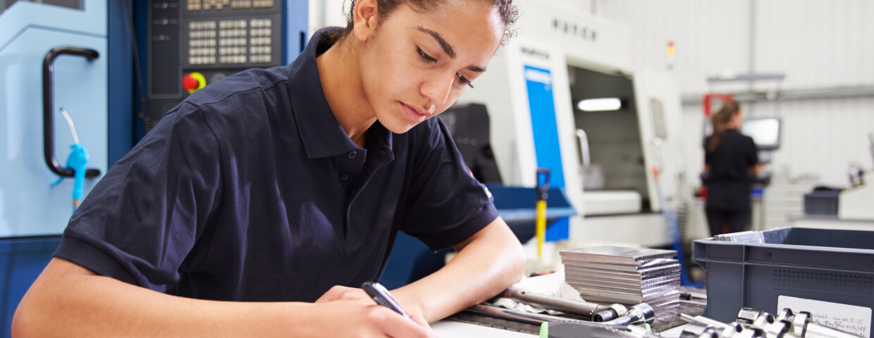 Girl taking notes at desk