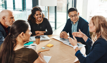 Group of business professionals around a table